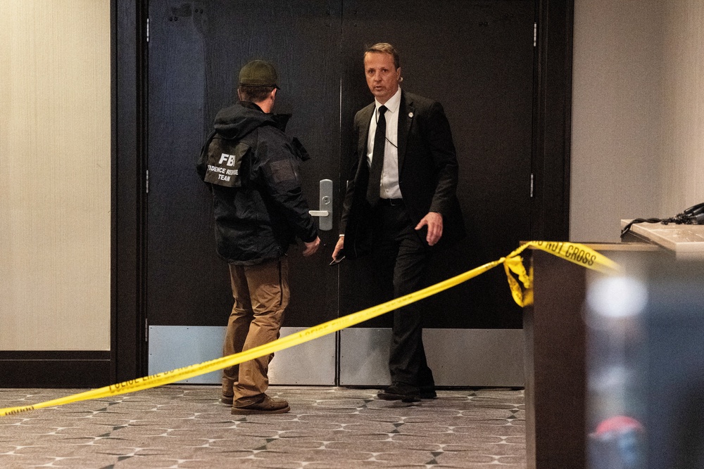 FBI personnel patrol the venue, following a shooting incident during the annual White House Correspondents' Association dinner, in Washington, DC, US, 25 April 2026 (Reuters)