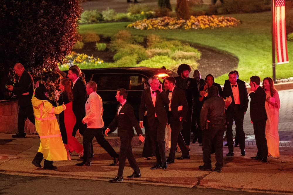 Attendees leave the venue as a shooter opens fire during the annual White House Correspondents' Association dinner in Washington, DC, US, 25 April 2026 (Reuters)