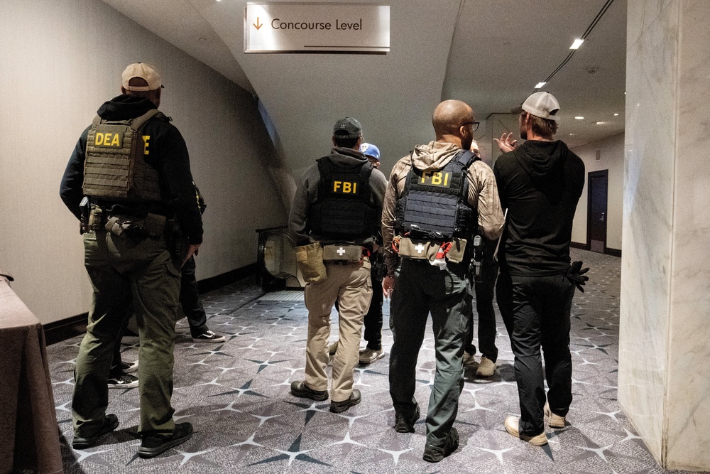 Law enforcement personnel patrol the venue, following a shooting incident during the annual White House Correspondents' Association dinner, in Washington, DC, US, 26 April 2026 (Reuters)