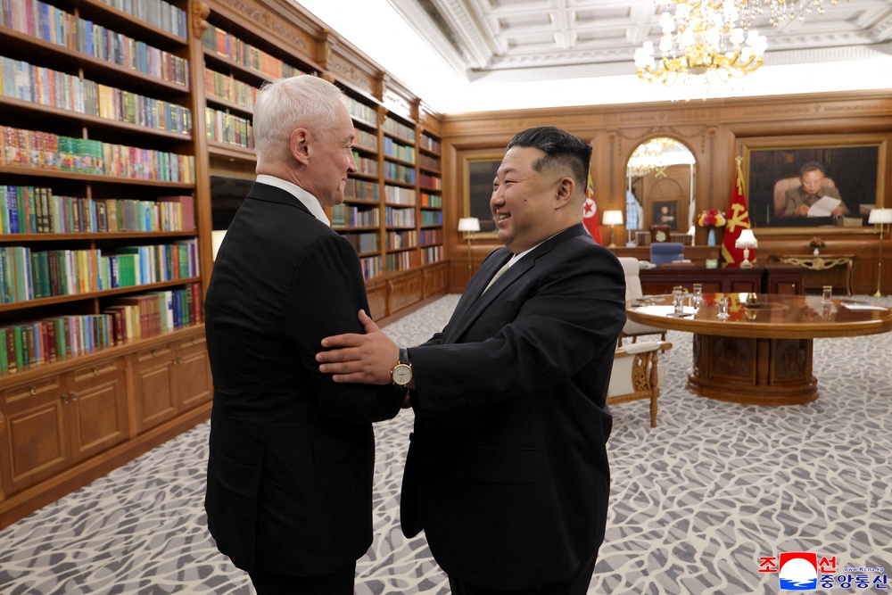 Kim Jong Un greets Russia's defence minister Andrei Belousov during Belousov's visit in Pyongyang (Reuters)