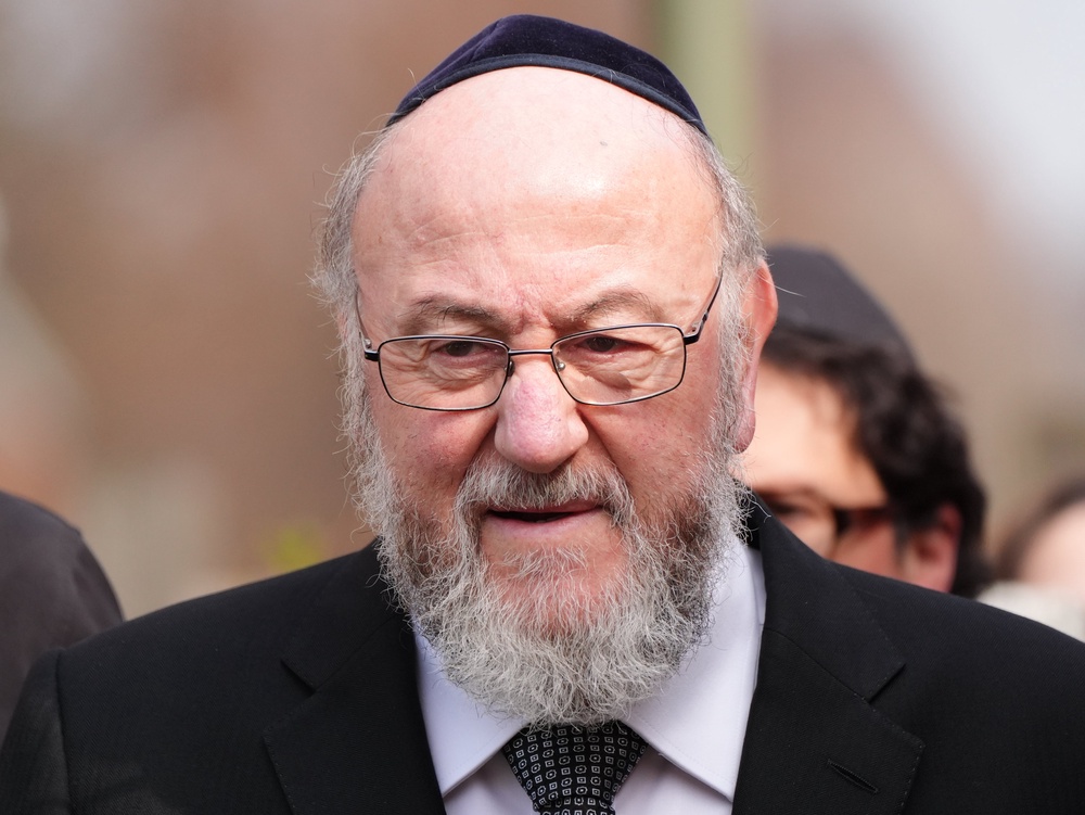 Chief Rabbi Sir Ephraim Mirvis at the scene in Highfield Road, Golders Green, London, after an apparent arson attack (Jonathan Brady/PA) (PA Wire)