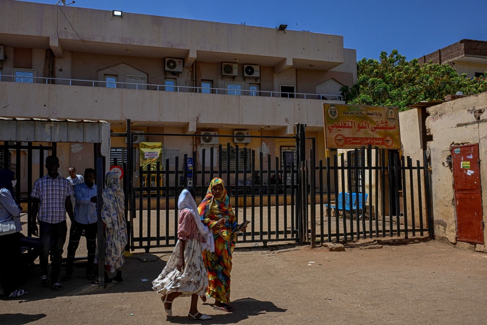 People standing outside the Al-Nao Educational Hospital (AFP/Getty)