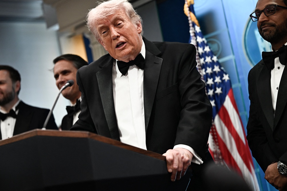 Trump, pictured at the dinner on 25 April, said he was likely the target of the attack (AFP/Getty)