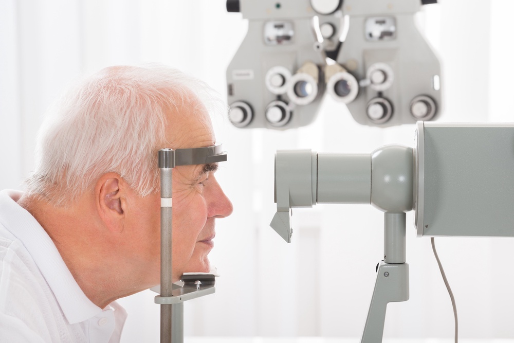 Close up of old man getting his eyes checked at an optician (Alamy/PA)