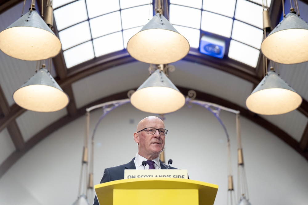 SNP leader John Swinney delivers a speech on the early actions a re-elected SNP government would take to support people, at the Pearce Institute, Glasgow (Jane Barlow/PA) (PA Wire)