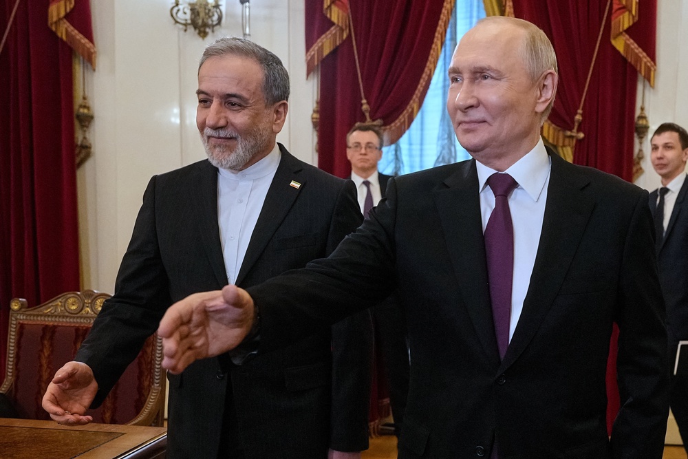 Russian President Vladimir Putin and Iranian Foreign Minister Abbas Araqchi attend a meeting at the Boris Yeltsin Presidential Library in Saint Petersburg (Reuters)