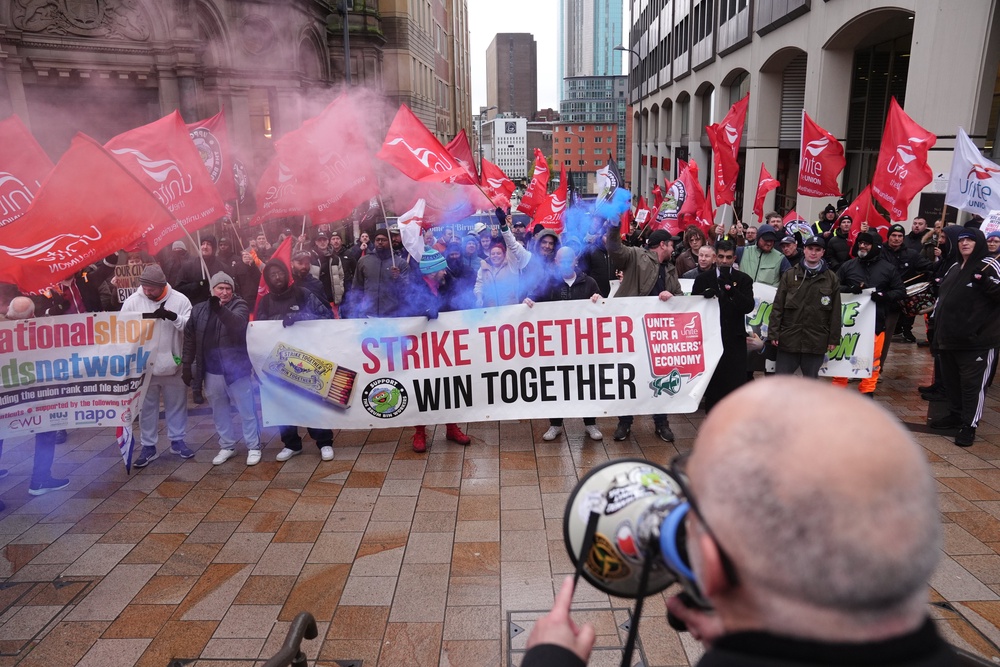Workers march during the strike action (PA) (PA Wire)