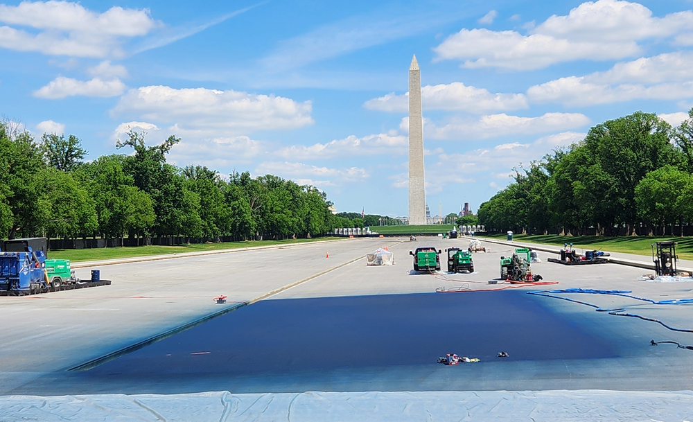 A blue square of ocean blue paint appeared at one end of the Reflecting Pool in front of the Lincoln Memorial last month (John Bowden/The Independent)