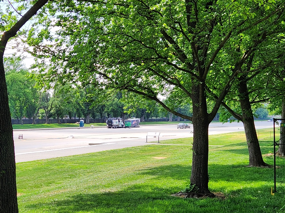 Only a small section of the Reflecting Pool has been painted over with the new surface, which began to appear last week (John Bowden/The Independent)