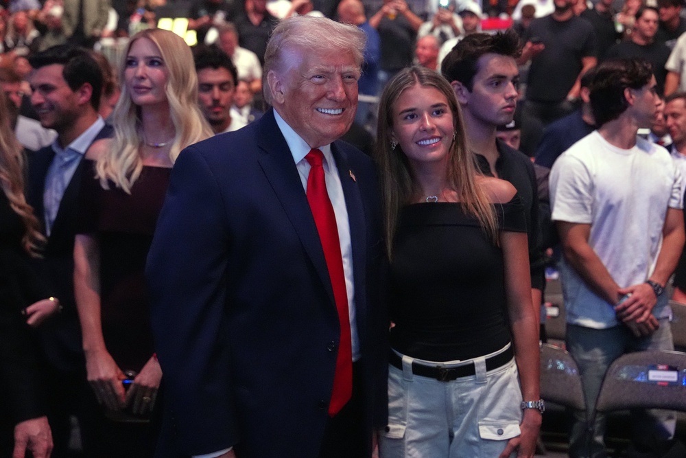 U.S. President Donald Trump poses for photos with Kai Trump during UFC 327 at Kaseya Center on April 11, 2026 in Miami, Florida. (Getty)