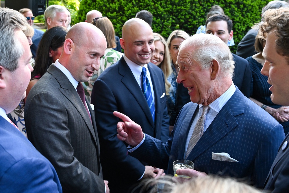 King Charles speaks with White House Deputy Chief of Staff for Policy Stephen Miller, an immigration hardliner, at the garden party (Getty)