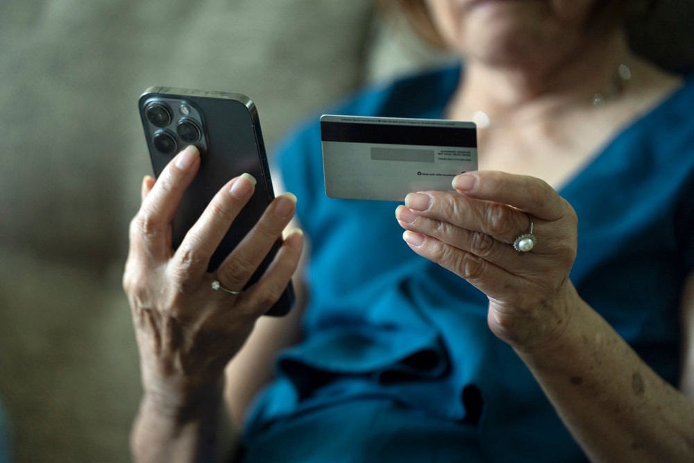 Investment scammers often invite their victims to private social media groups where they can use social engineering techniques to build false trust (Lim Weixiang / Zeitgeist Photos / iStock)