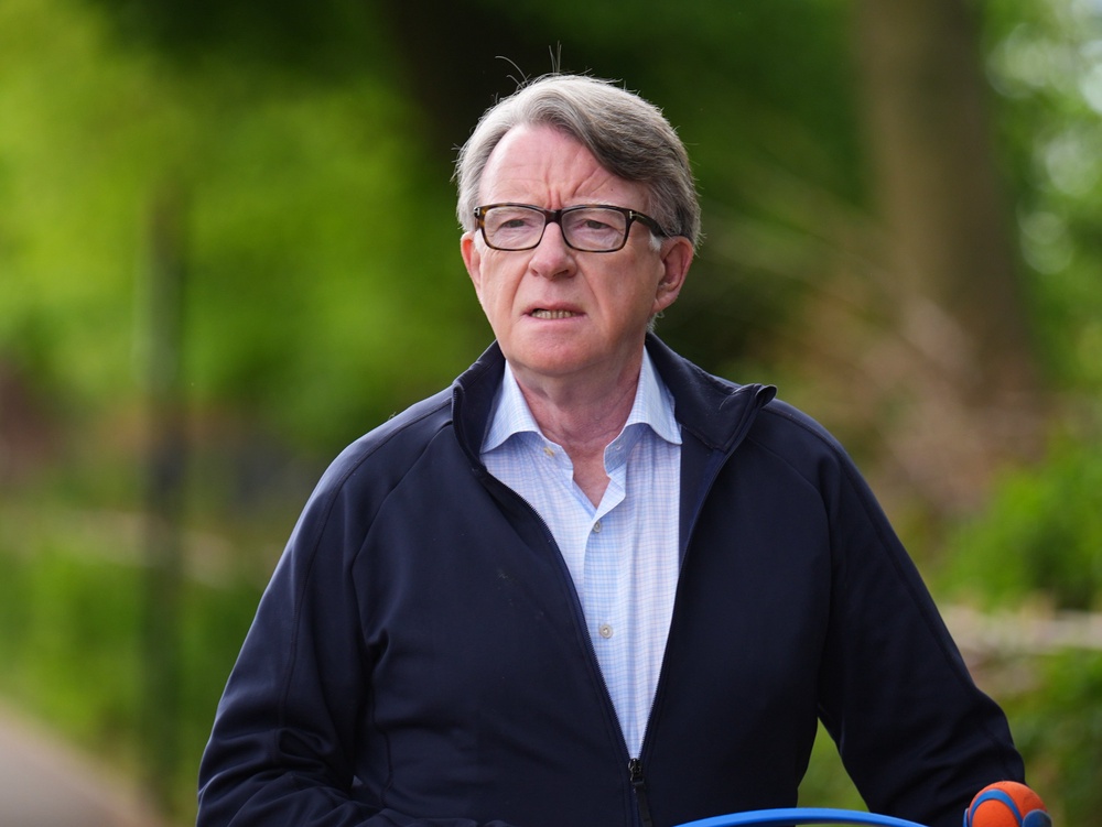 Lord Peter Mandelson taking his dog for a walk outside his home in London (PA) (PA Wire)