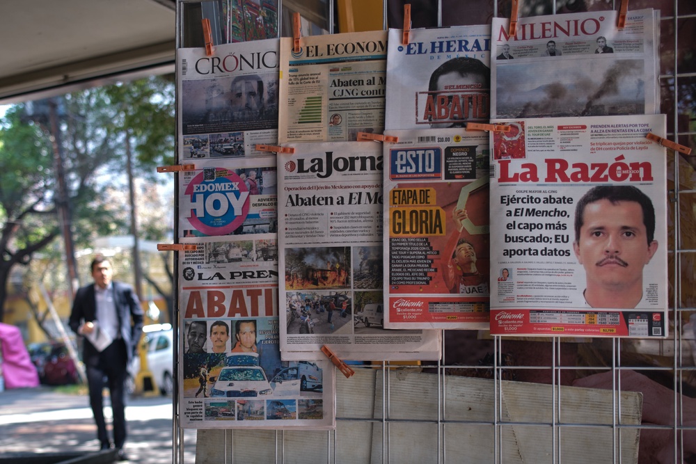 Newspapers hang on display for sale in Mexico City, Monday, Feb. 23, 2026, a day after the Mexican army killed Jalisco New Generation Cartel leader Nemesio Oseguera Cervantes, known as “El Mencho” (Copyright 2026 The Associated Press. All rights reserved)