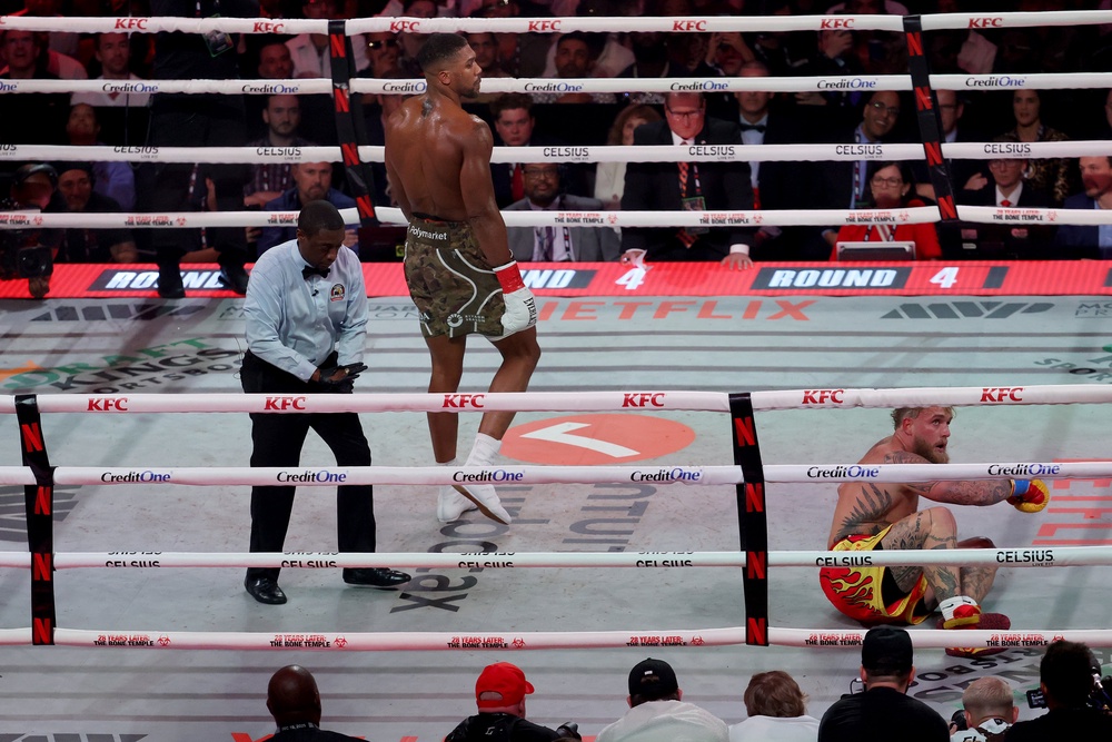 Joshua was able to pin down an elusive Paul in the sixth round and secure a TKO (Getty)