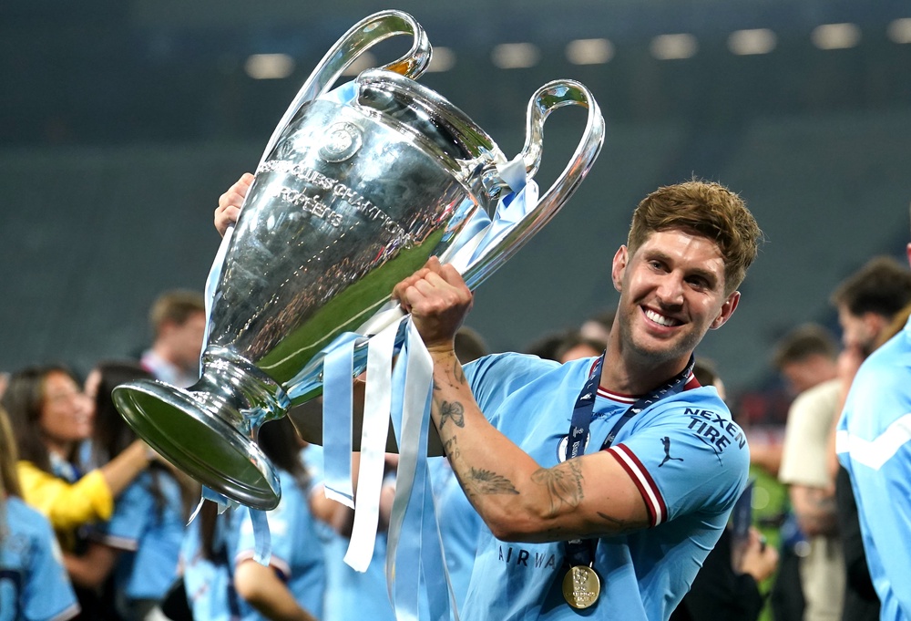 John Stones holds the Champions League trophy (Martin Rickett/PA) (PA Archive)