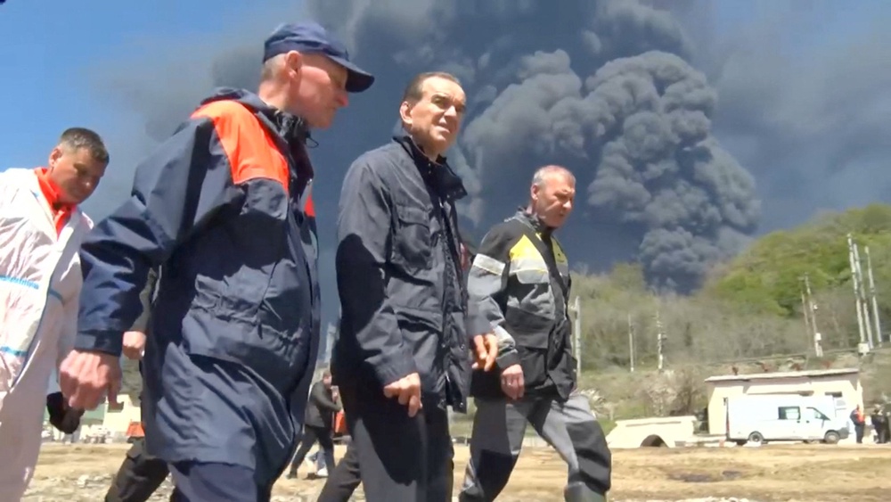 Krasnodar region's Governor Veniamin Kondratyev walks along the coastline while inspecting emergency services following a Ukrainian drone attack that caused a fire at an oil refinery, amid the Russia-Ukraine conflict, in Tuapse, Russia, April 28 (Reuters)