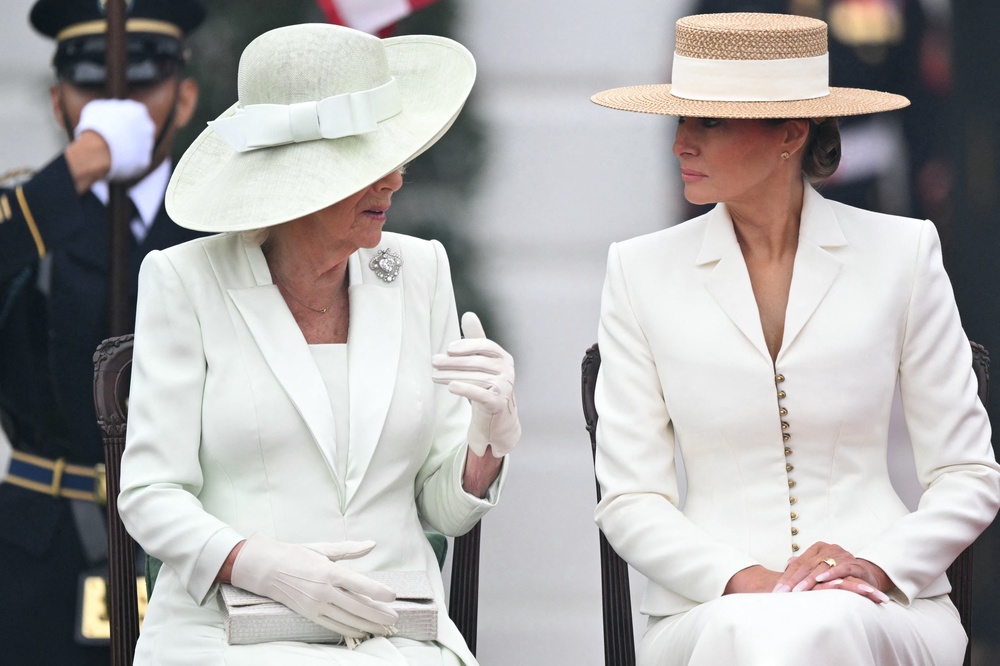 First lady Melania Trump — who is currently engaged in a war of words, and potentially censorship, with late-night host Jimmy Kimmel — speaks with Britain's Queen Camilla during the arrival ceremony on the South Lawn of the White House Tuesday morning. (AFP/Getty)