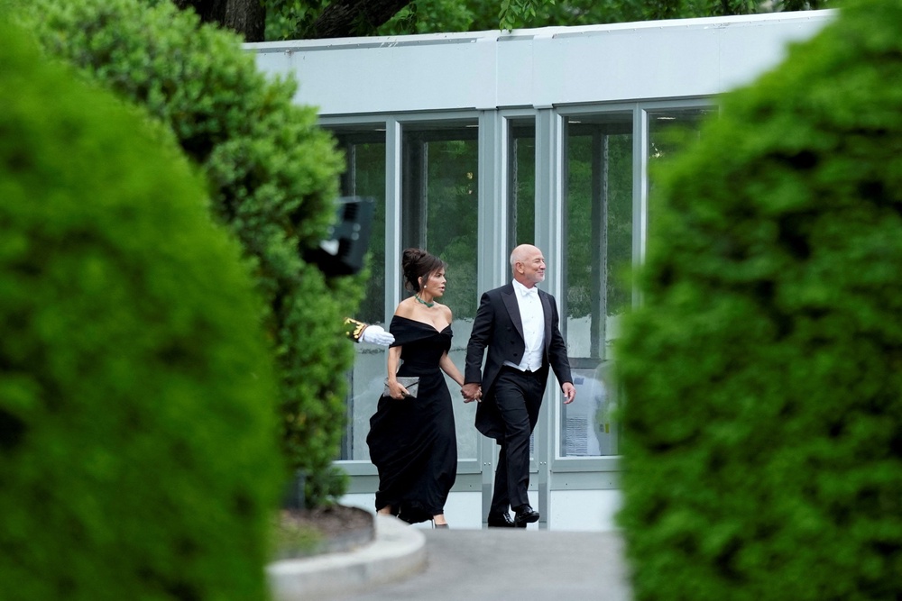 Amazon founder Jeff Bezos and his wife, Lauren Sanchez Bezos, arrive at the White House for a state dinner with King Charles (REUTERS)