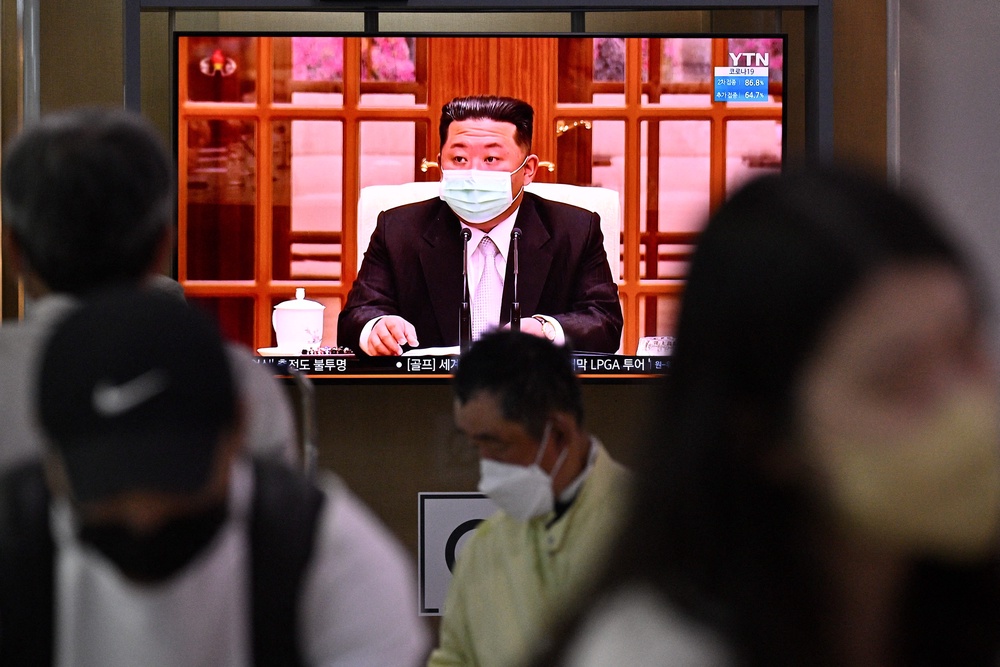 North Korea's leader Kim Jong Un appearing in a face mask on television for the first time to order nationwide lockdowns after the North confirmed its first-ever Covid-19 cases (AFP via Getty Images)
