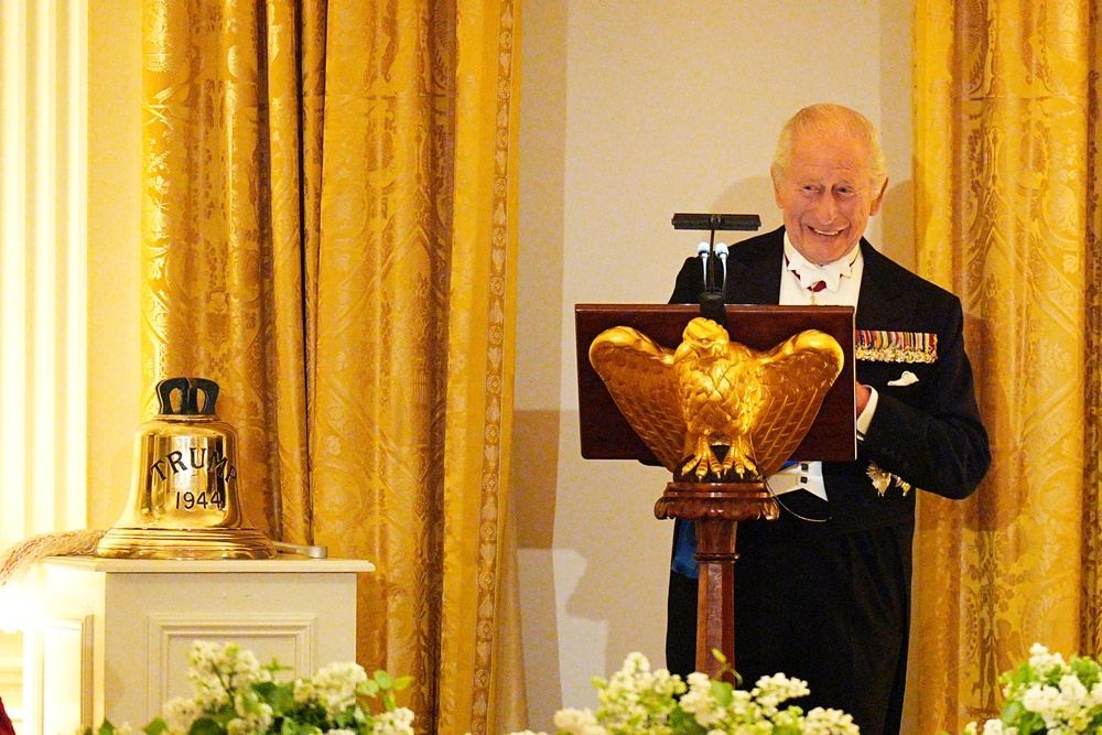 The King presents Mr Trump with the HMS Trump bell (Aaron Chown/PA) (PA Wire)