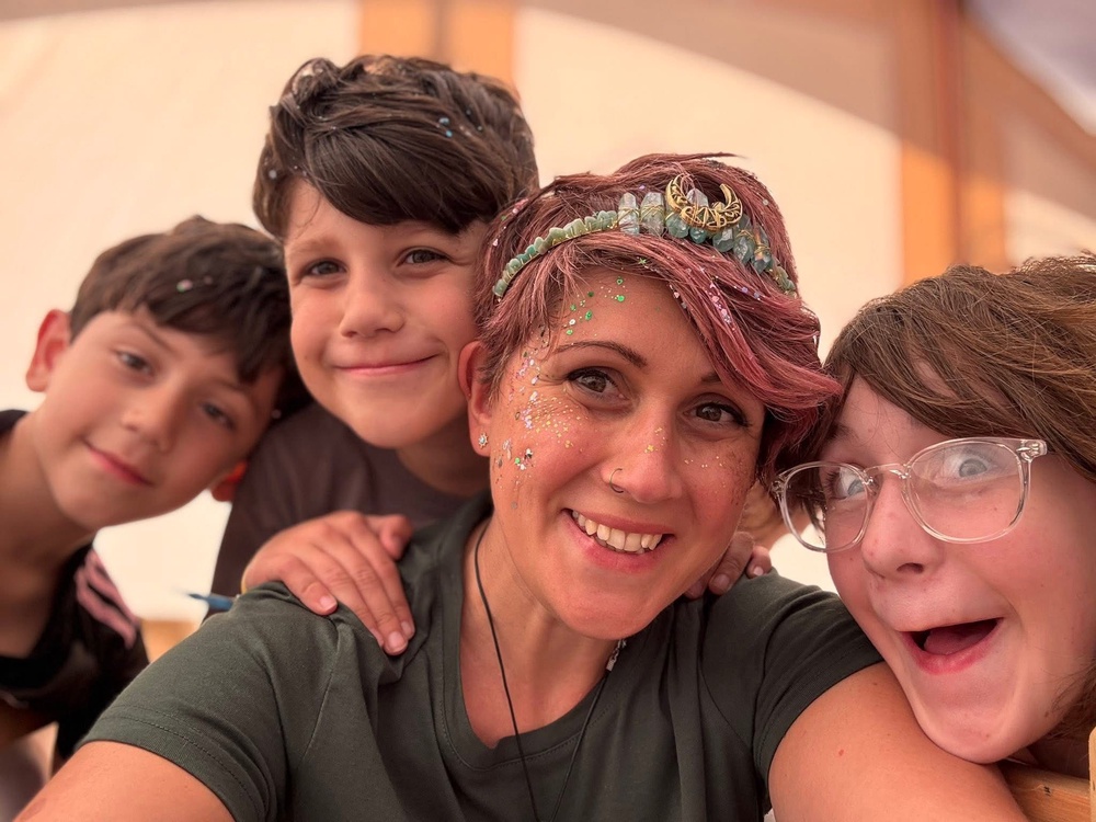 Jemma and the three children at a festival together after Jon died (Collect/PA Real Life)
