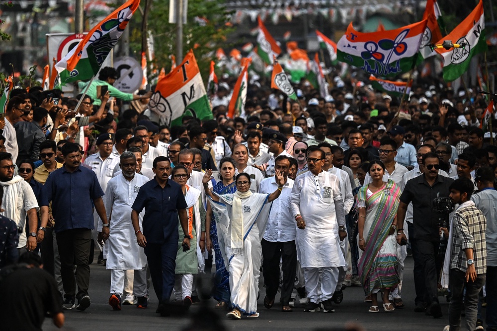 Mamata Banerjee, centre, during a campaign rally ahead of the second phase of the legislative elections (AFP via Getty)