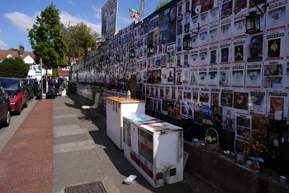 Fire damage to a cabinet beside the memorial wall on Limes Avenue in Golders Green, north west London on Tuesday (PA) (PA Wire)