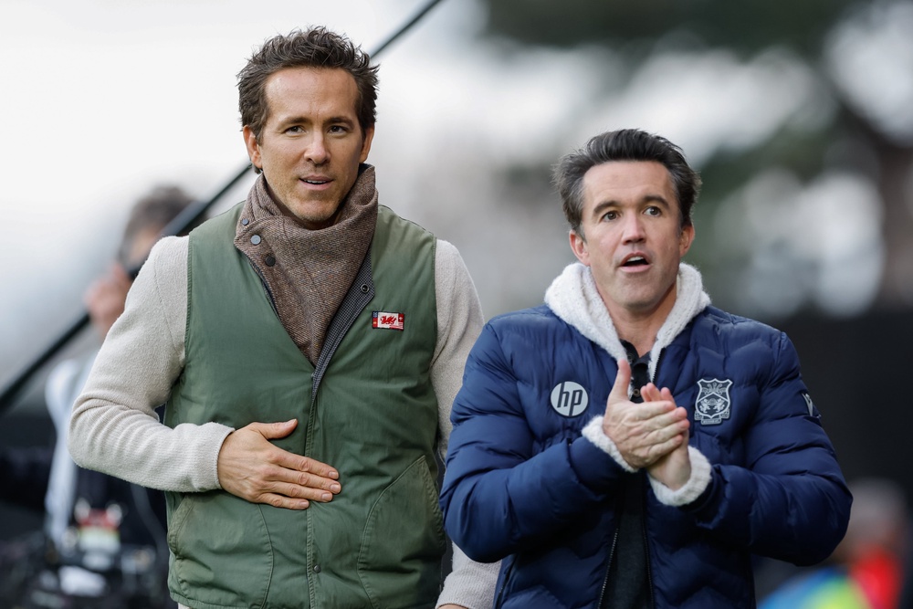 Co-owners Ryan Reynolds and Rob Mac will be hoping Wrexham can make the play-offs (PA Wire)