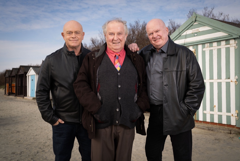 From L-R: Grant, Nigel and Phil Mitchell in their flashback scenes at the beach (BBC/Jack Barnes/Kieron McCarron)