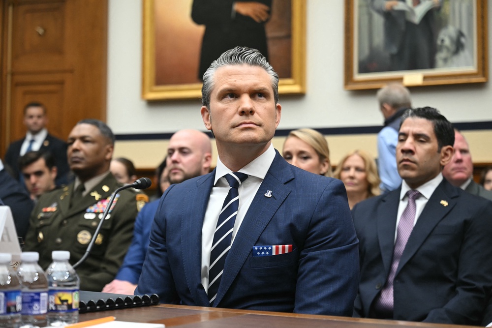 Hegseth takes his seat (AFP/Getty)