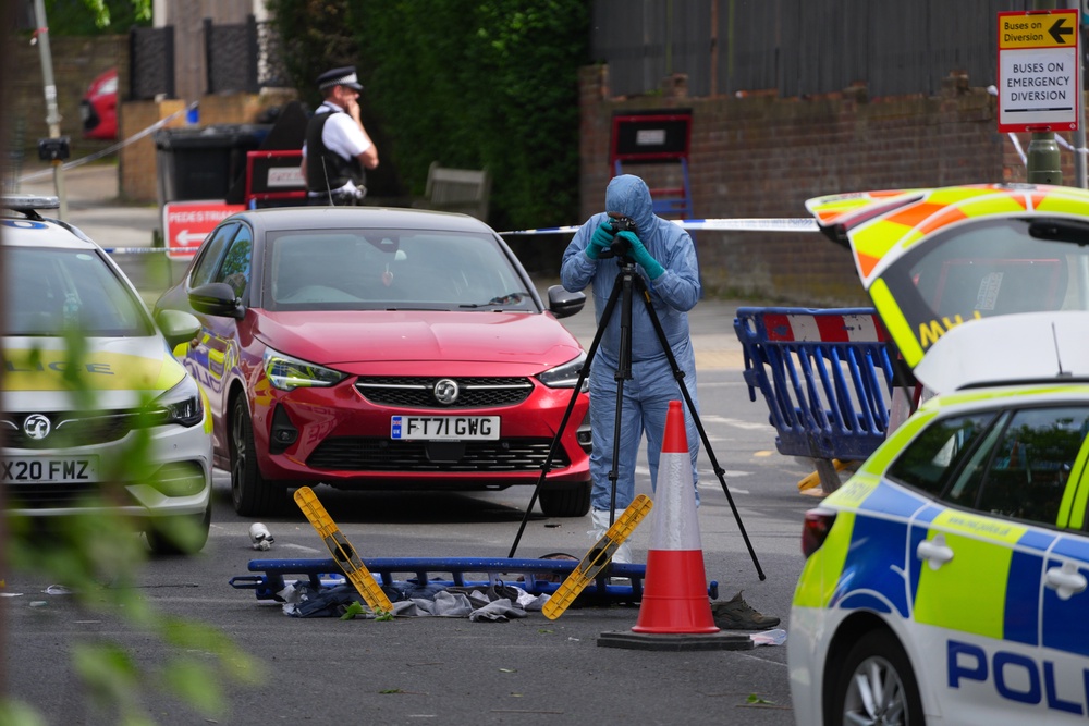 Forensic officers at the scene (Getty)