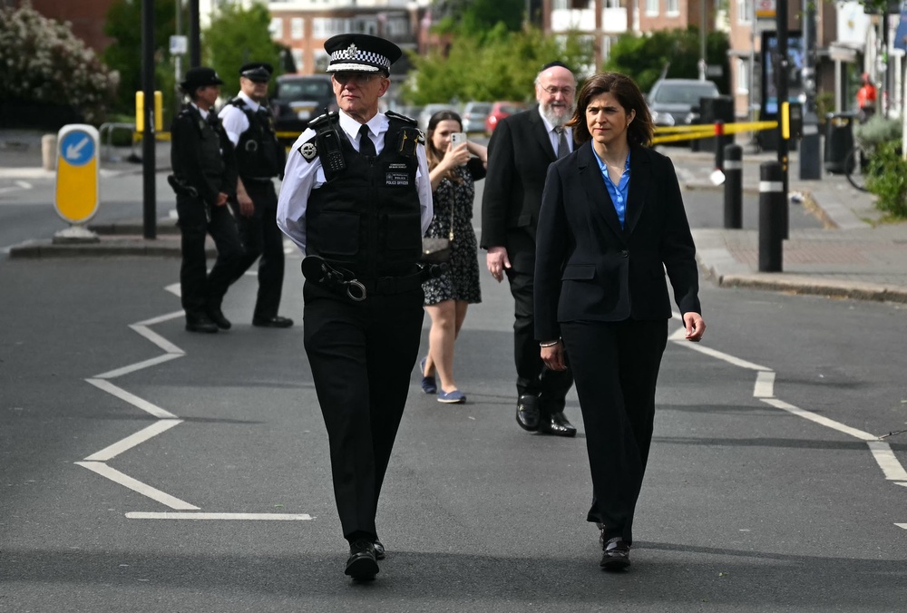 Local MP Sarah Sackman with Met Police commissioner Sir Mark Rowley at the scene (AFP/Getty)