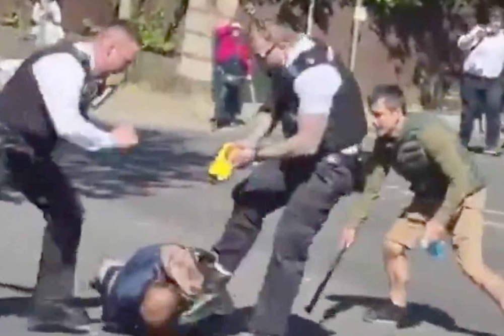 Police tasered the suspected knifeman as he lunged at them with a knife (X)