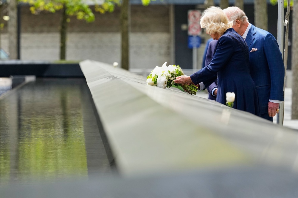 Queen Camilla lays flowers at the 9/11 Memorial during a visit with King Charles III and former New York City Mayor Michael Bloomberg (AP)