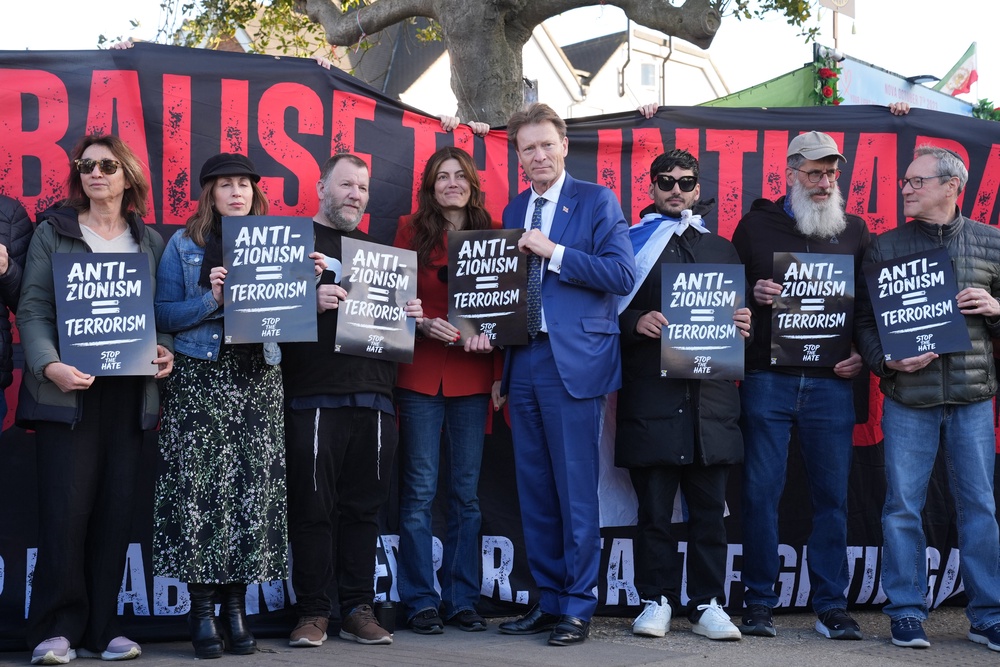 Reform UK deputy leader Richard Tice joins people protesting near the scene in Golders Green (Lucy North/PA) (PA Wire)
