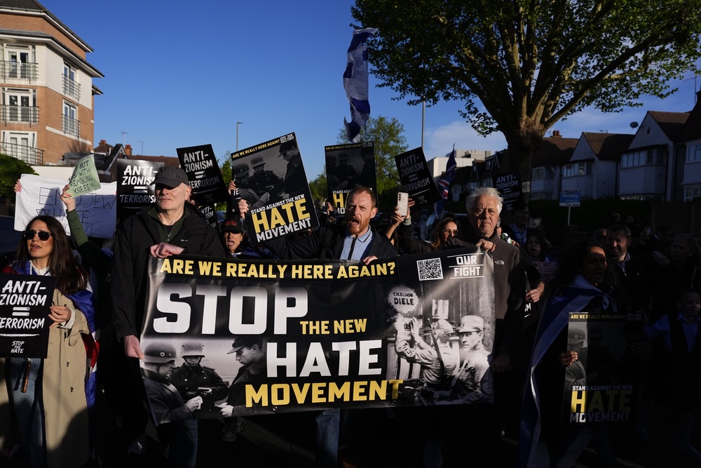 People protest near the scene in Golders Green (Jordan Pettitt/PA) (PA Wire)