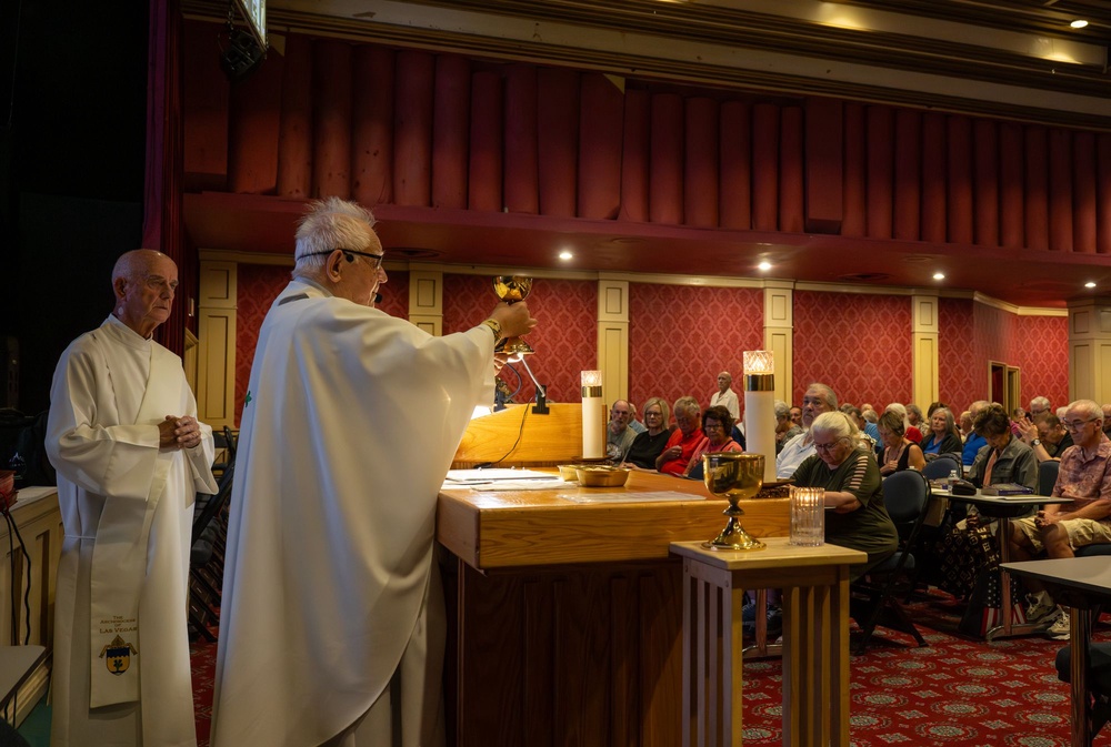 Father Charlie Urnick is known for leading Mass with a lively sense of humor, which some out-of-town worshippers also follow through the services’ livestreams (Montie Chavez)