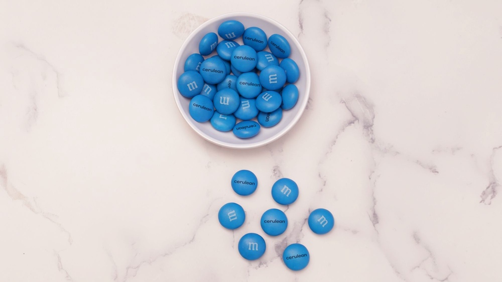 The cerulean M&M's will be available for free on a first-come, first-serve basis (Courtesy of Marc, Inc.)