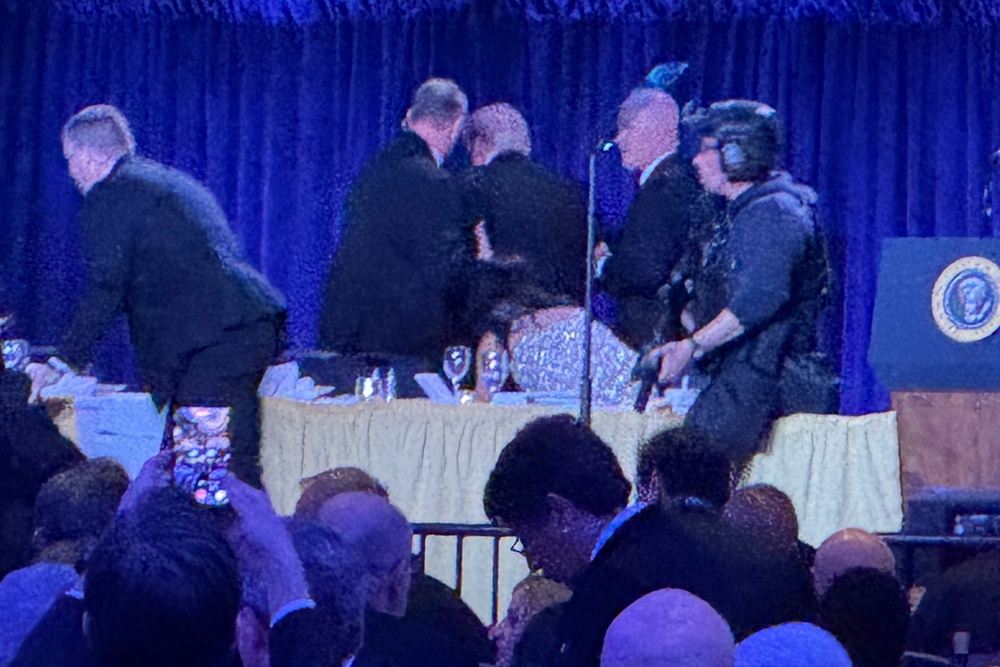 Secret Service agents rush Donald Trump out of the room following an attempted assasination attempt during the White House Correspondent’s dinner Saturday. Days before Jimmy Kimmel had made a joke about the First Lady having the ‘glow of an expectant widow’ (AP)