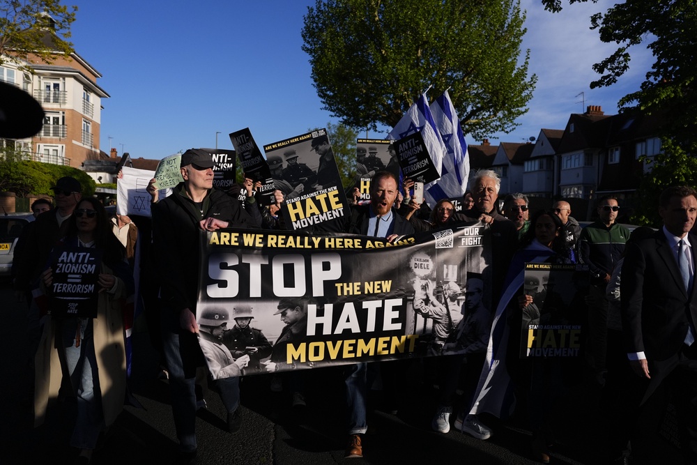 People protest near the scene in Golders Green (PA) (PA Wire)