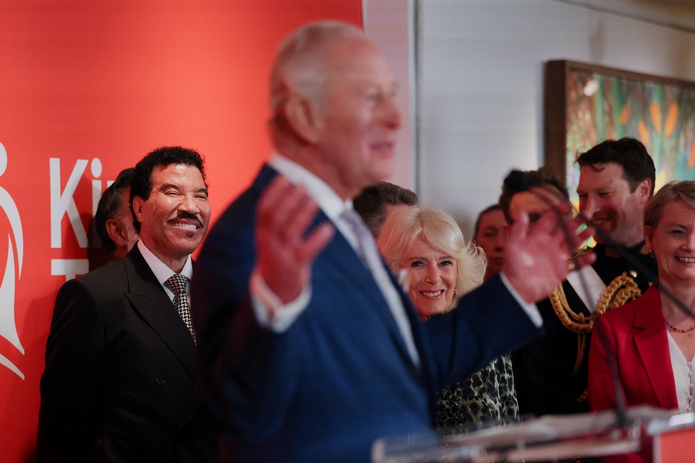 Lionel Richie (left) and Camilla react as Charles speaks at the Greater Together Reception (Suzanne Plunkett/PA) (PA Wire)