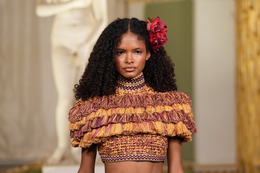 Models walked down the Annie’s Ibiza runway with floral hair accessories during London Fashion Week (Lucy North/PA)