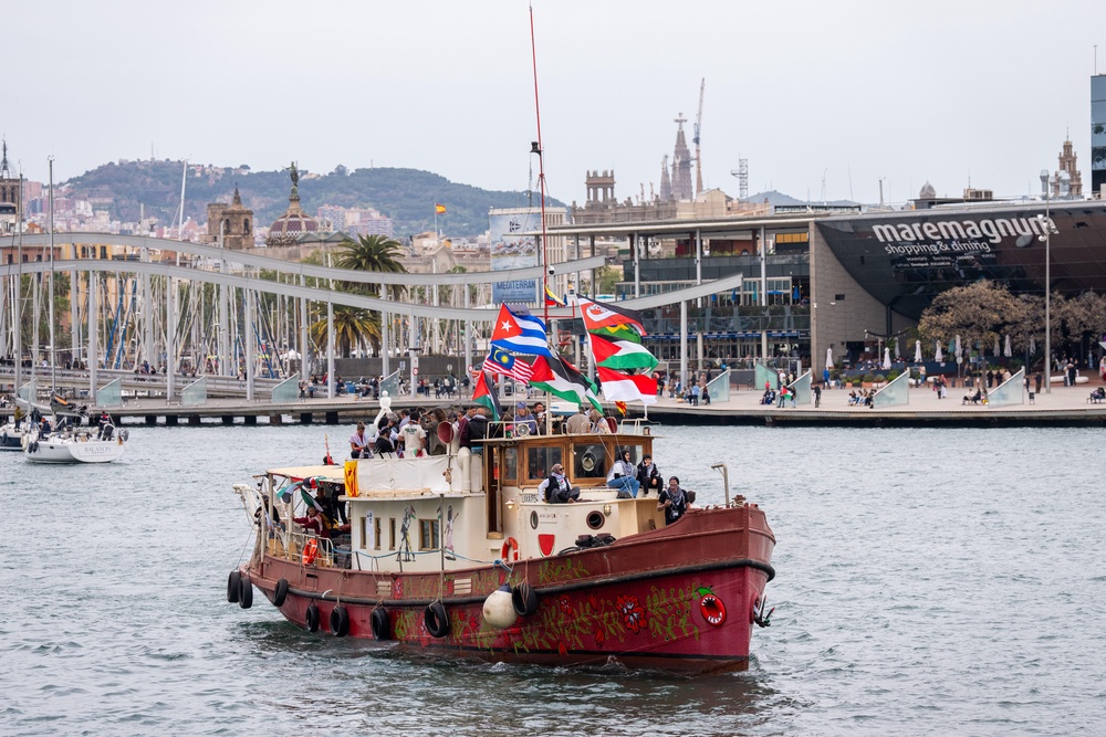 Boats carrying activists and humanitarian aid for Gaza participate in the symbolic departure of the Global Sumud Flotilla in Barcelona on 12 April (AP)