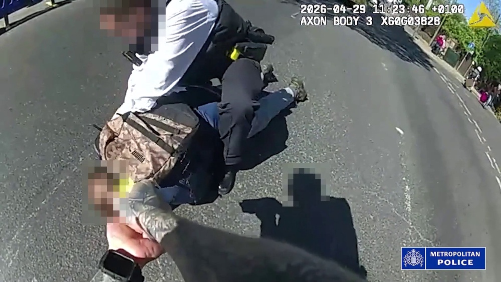 Screen grab from a body worn camera issued by  the Metropolitan Police of police officers confronting and arresting a 45-year-old suspect (Metropolitan Police)