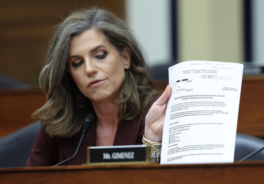 Rep. Nancy Mace (R-SC) presents documents related to Rep. Cory Mills (R-FL) as she participates in the House Armed Services Committee hearing with Hegseth (Getty)
