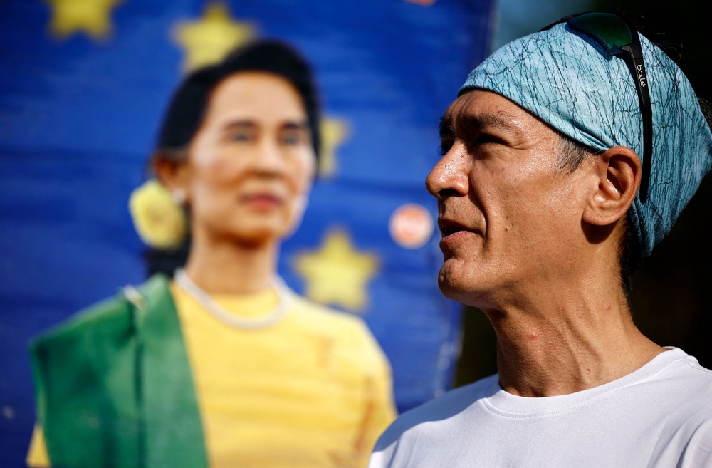 Kim Aris, son of Aung San Suu Kyi, speaks to supporters in London on his mother’s 80th birthday last year (AFP/Getty)