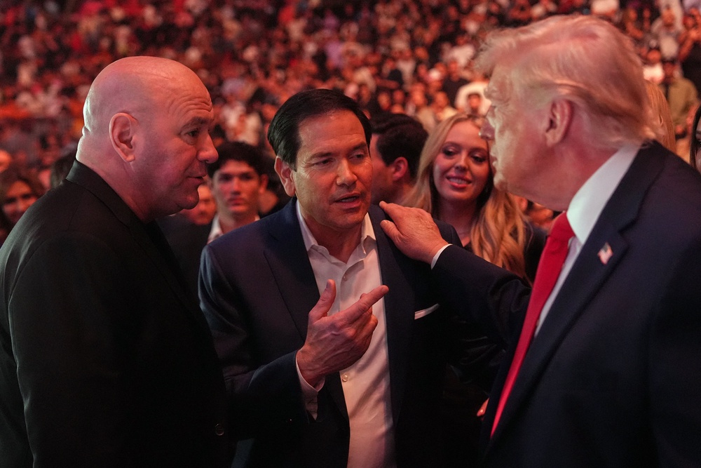 Mr Trump with UFC president Dana White (left) and US Secretary of State Marco Rubio at UFC 327 in April (AFP/Getty)