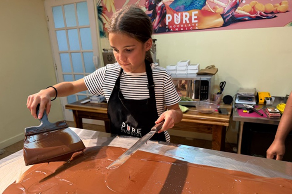 Tempering the chocolate – heating and cooling it – before making your own bar is the best part of the process (The Independent)