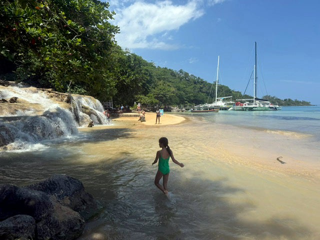 Splashing around on the north coast of Jamaica, where Dunn’s River falls flows into the sea (The Independent)